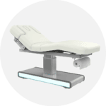 Modern white examination and treatment table with adjustable height and under-base lighting. Premium patient couch.