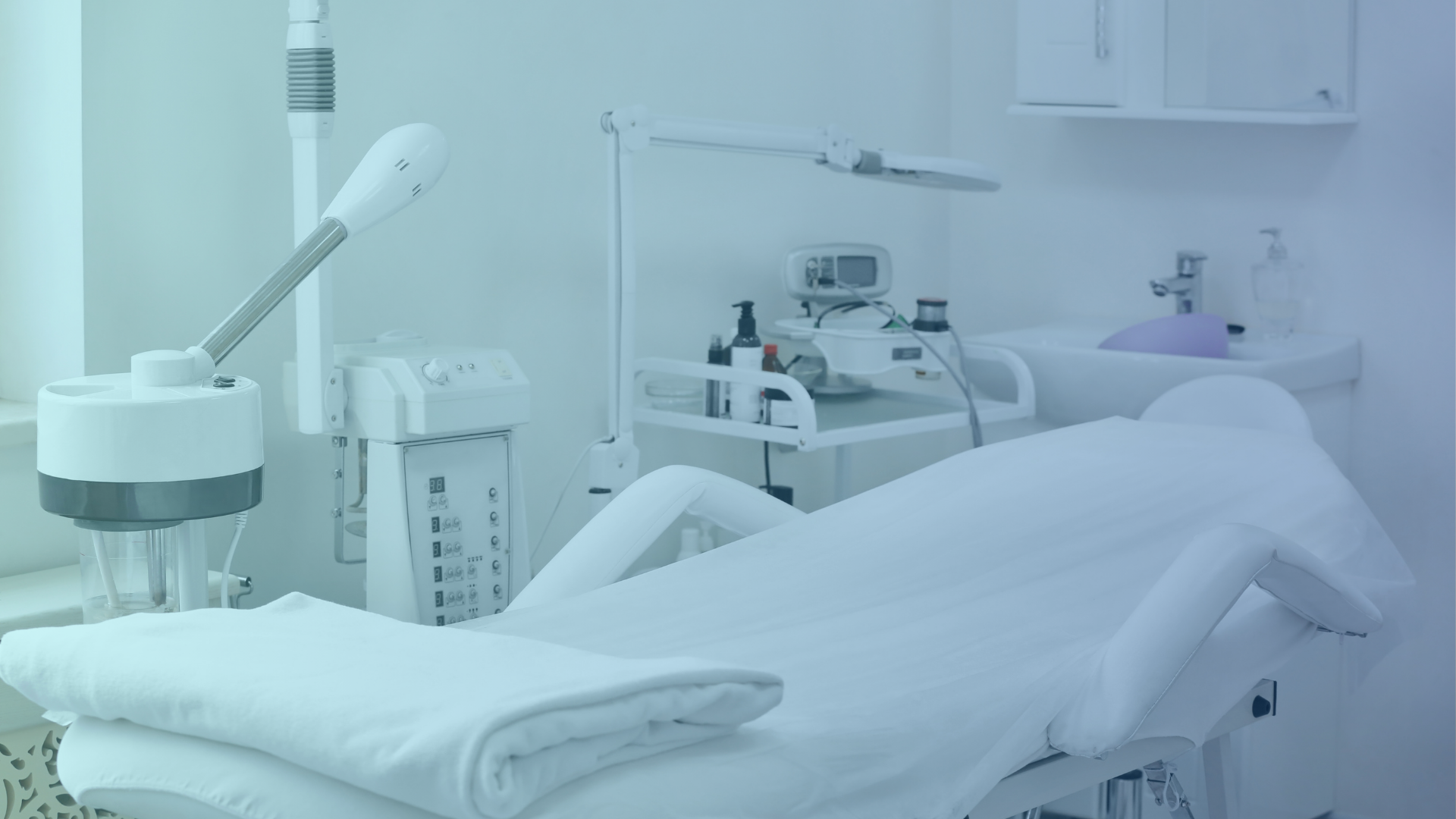 Modern aesthetic clinic room with beauty treatment bed and facial steamer. Medical equipment supplier Dubai.